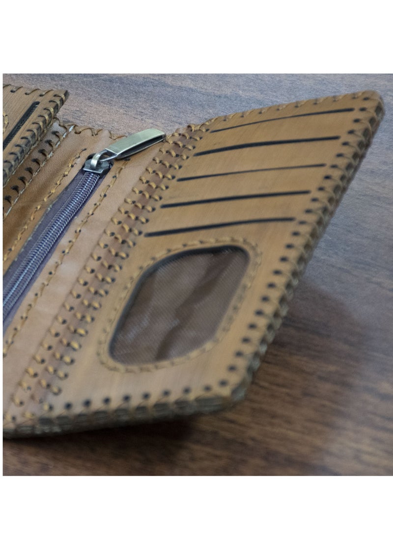 Handmade Genuine Leather Wallet – Premium Quality & Elegant Design!  100% genuine leather Unique laser engraving detail Magnetic clasp for secure closure Internal zipper with multiple compartments Luxurious lining and photo mesh Size: 9×20 cm – practical and stylish Plenty of card slots and large pockets for organized storage Available now at the best price on  Noon with fast and safe delivery!
