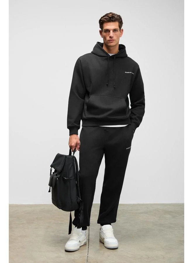 جريميلانج MARSHALLHOODIE للرجال بدلة رياضية قطنية مبطنة بالصوف مطرزة بتصميم مريح باللون الأسود.