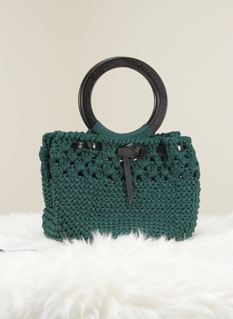 Green Crochet Handbag with Black Circular Handle and Leather Bow Detail
