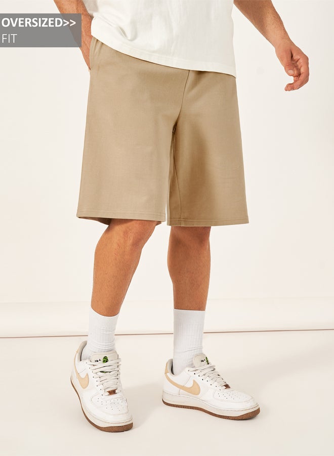 ستايلي شورت سادة فضفاض بأربطة خصر - Image 1