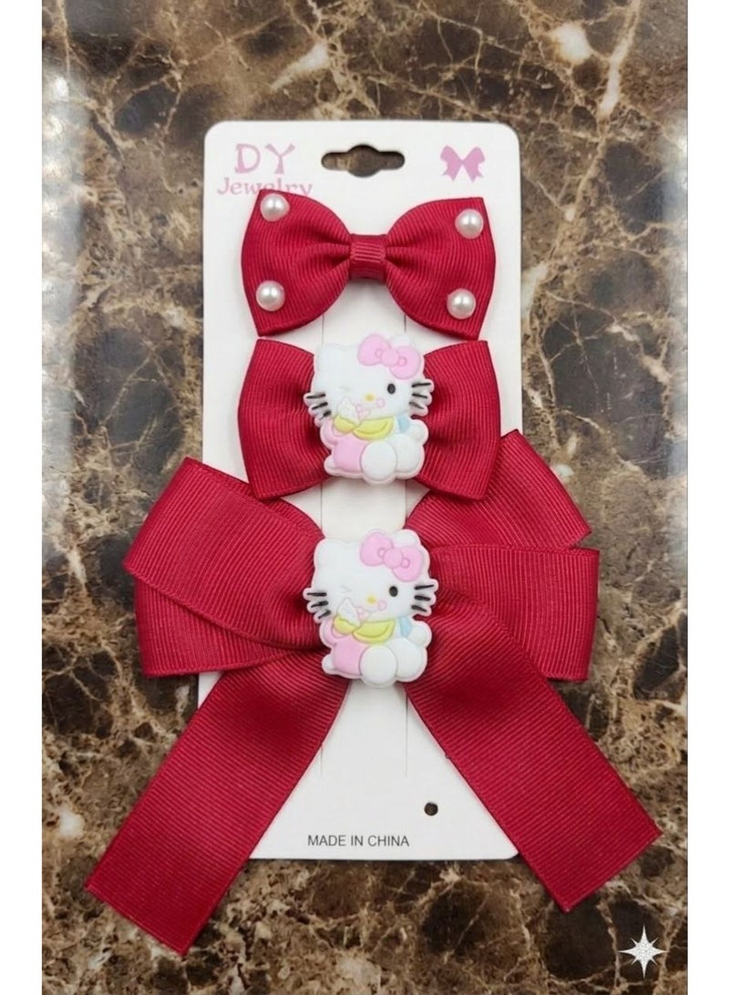 A set of 3 red hair clips with anime designs for children.