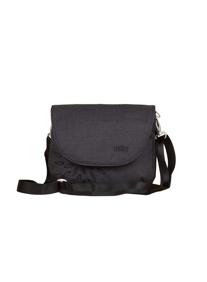 HAIKU Bliss Eco-Friendly RFID Blocking Travel Crossbody Saddle Bag, Black in Bloom - Image 1