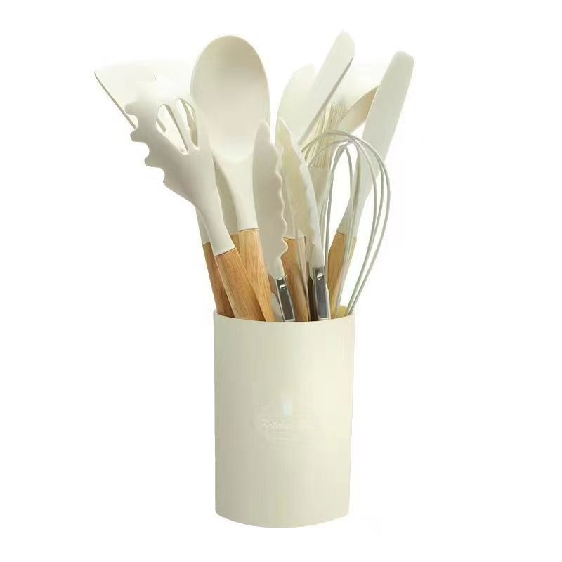 Cross-border wholesale wooden handle silicone kitchenware 12 pieces suit household high temperature resistant cooking silicone spatula soup spoon suit Milky white