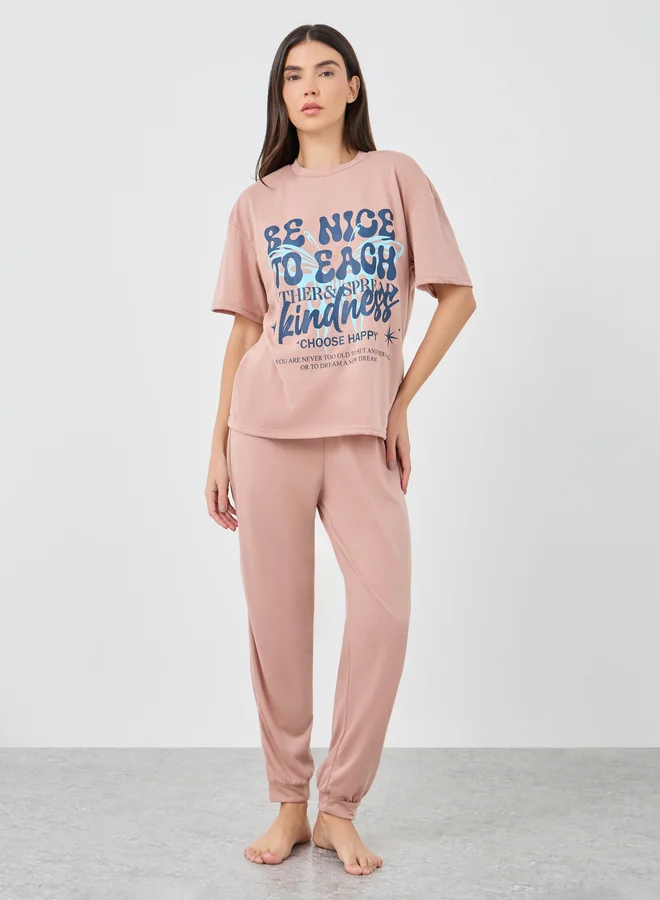 Styli Styli Be Nice Graphic Dropped Shoulder T-Shirt and Cuffed Pyjama Set
