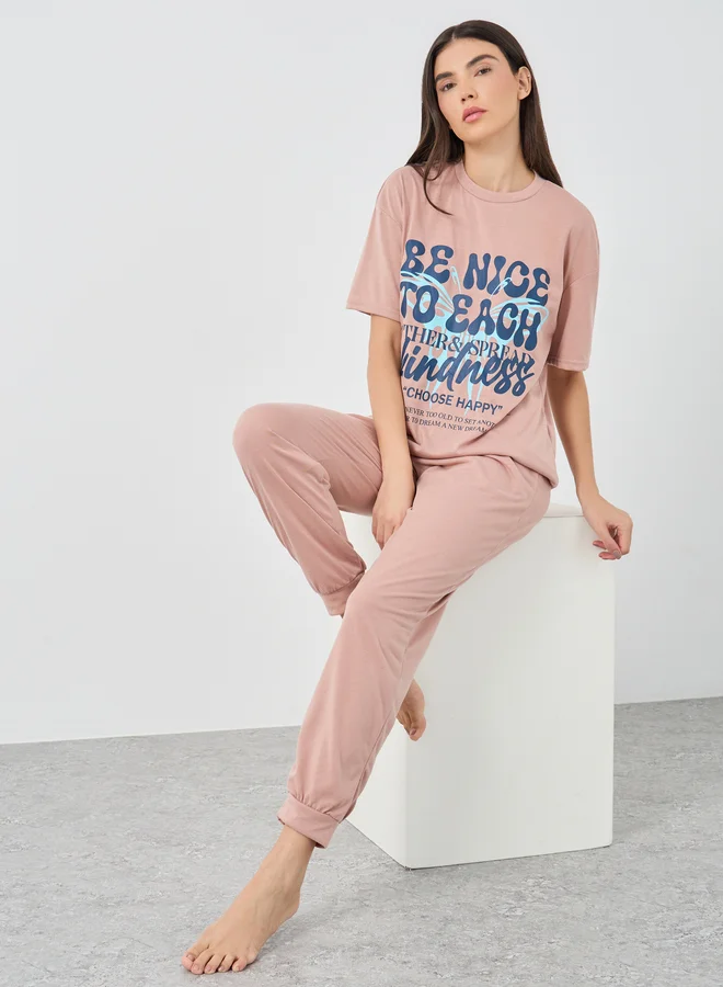Styli Styli Be Nice Graphic Dropped Shoulder T-Shirt and Cuffed Pyjama Set