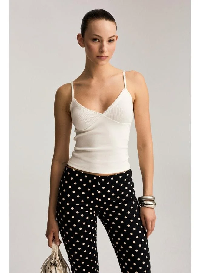 Ethiquet NIA Women's Organic Cotton Soft and Flexible Fabric White Tank Top with Ruffle Details.