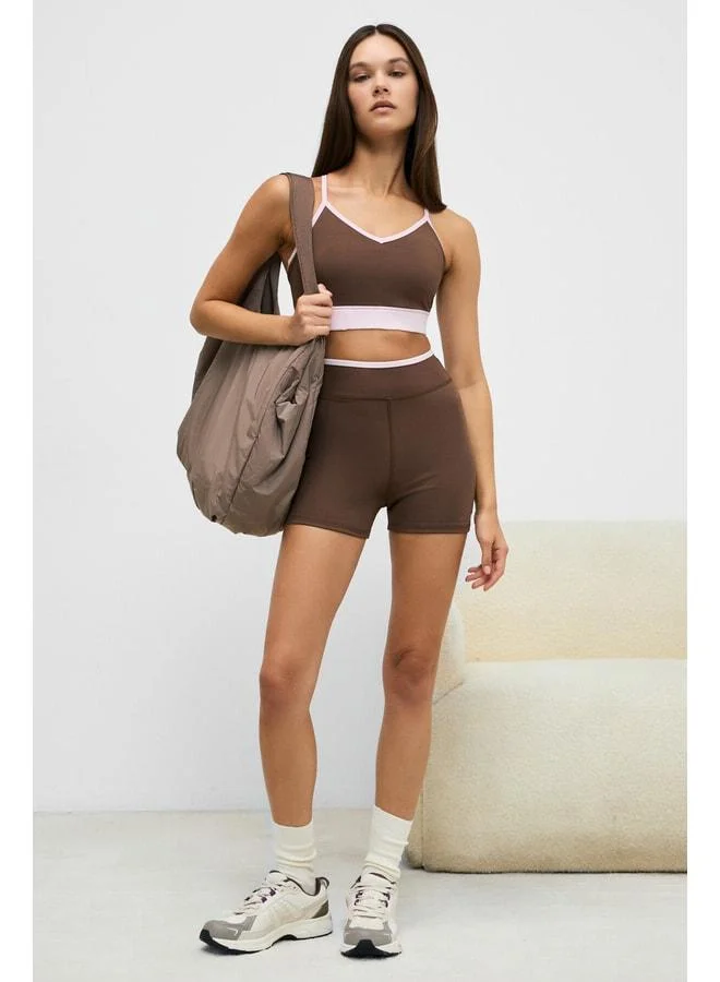 Urban Beat DOSHORIX Women's Stretchy and Soft-Textured Contrast-Piped Short Dark Brown Leggings.