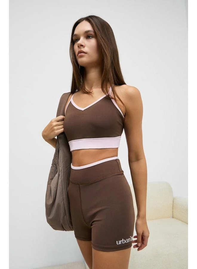 Urban Beat  DOSHORIX Women's Stretchy and Soft-Textured Contrast-Piped Short Dark Brown Leggings. for Women | Best Price UAE