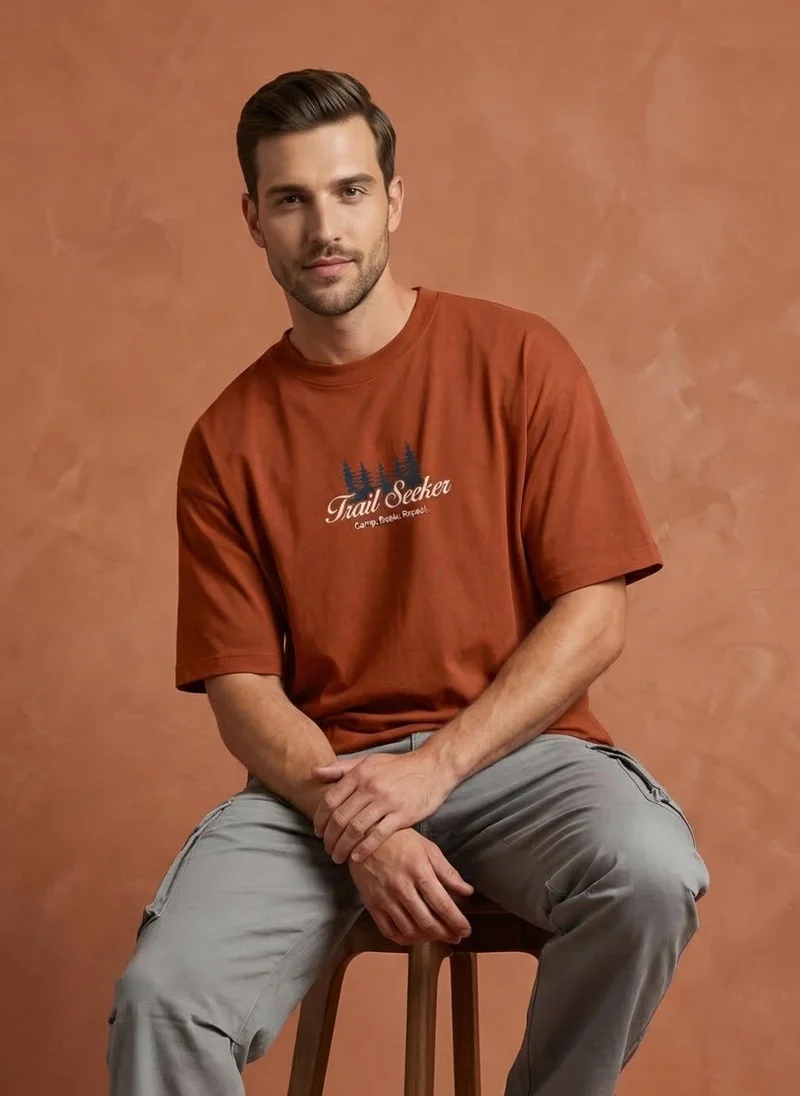 NOBERO Rust Orange Men Oversized Graphic Printed T-shirt for Men | Best Price UAE