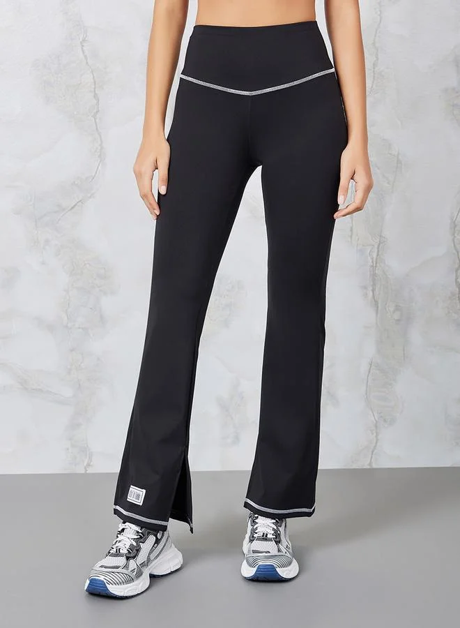 Styli Gymspire Edition - Label Contrast Stitch Detail Inner Side Slit Flared Leggings