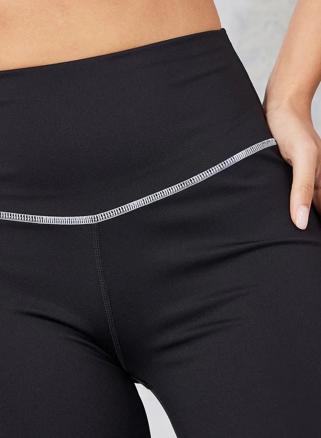Styli Gymspire Edition - Label Contrast Stitch Detail Inner Side Slit Flared Leggings