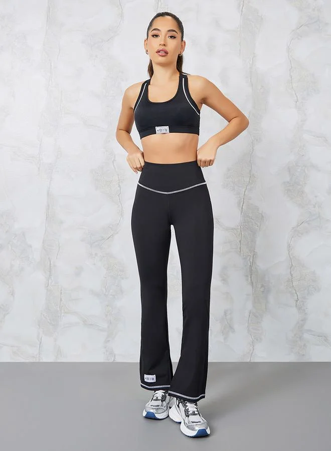 Styli Gymspire Edition - Label Contrast Stitch Detail Inner Side Slit Flared Leggings