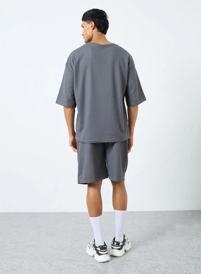Styli Styli Solid Textured Knit Oversized Streetwear T-Shirt & Shorts Set