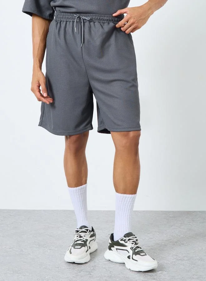 Styli Styli Solid Textured Knit Oversized Streetwear T-Shirt & Shorts Set