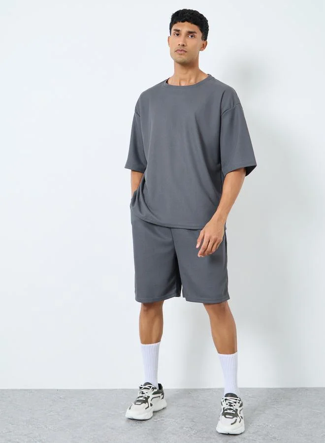 Styli Styli Solid Textured Knit Oversized Streetwear T-Shirt & Shorts Set