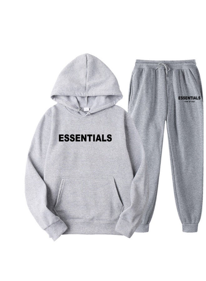 إيسنشالز مجموعة سويت شيرت بقلنسوة للجنسين - سويت شيرت وسروال بملاءمة فضفاضة مع طباعة حروف - Image 1