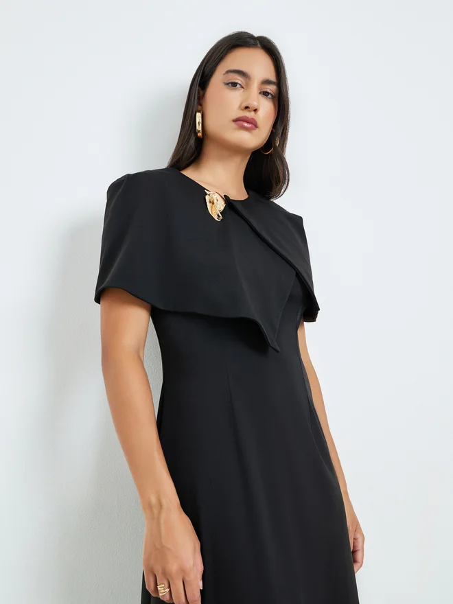 Styli Styli Black Cape Style Midi Dress with Brooch Accent