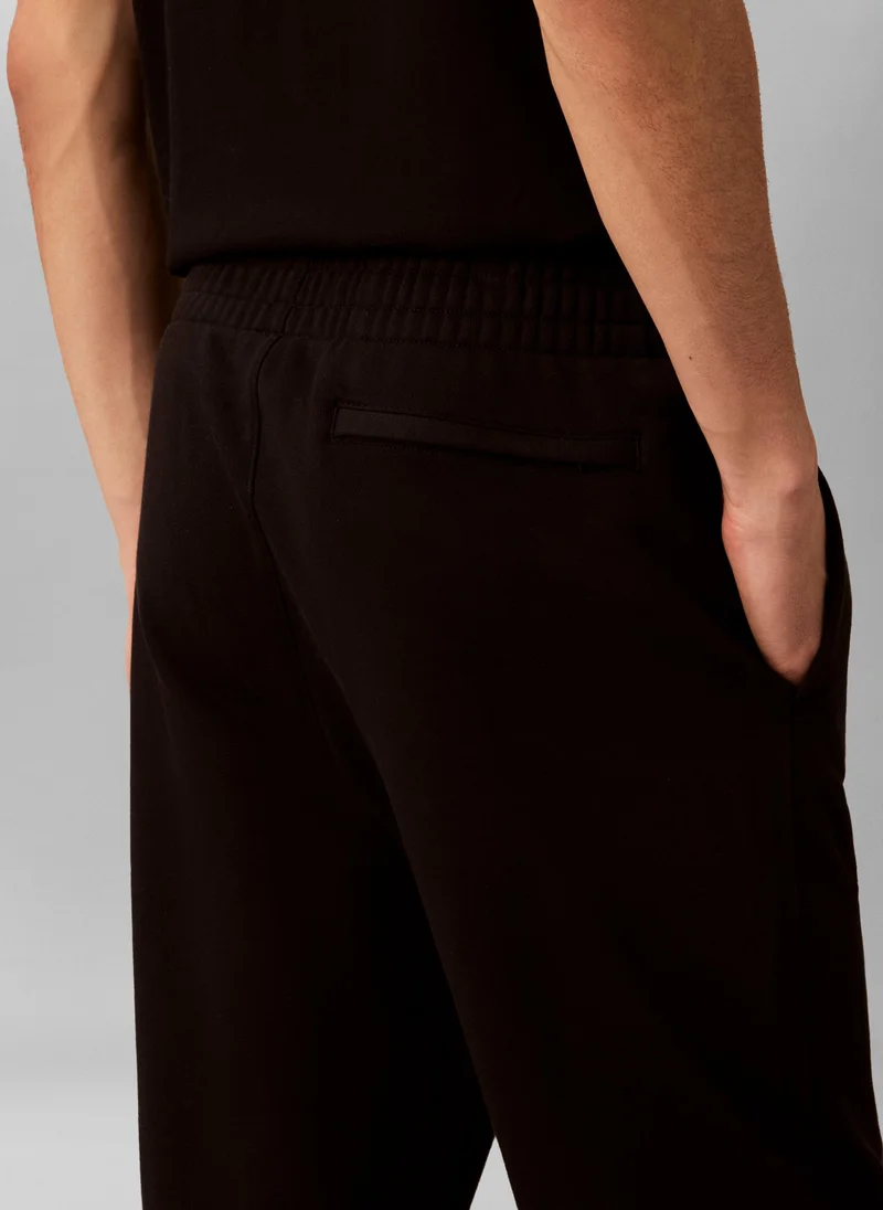 Calvin Klein Jeans black Cuffed Hem Drawstring Sweatpants for Men | Best Price UAE