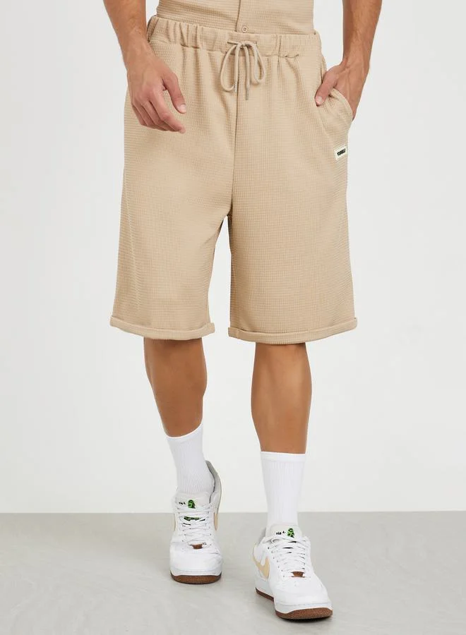 Styli Waffle Knit Oversized Shorts with Turn Up Hem & Badge Detail