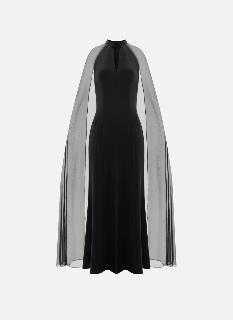 Lichi Maxi dress with flower on the collar and a light cape