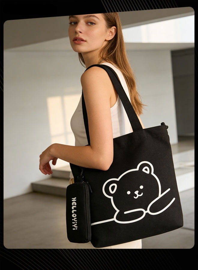 Joychic حقيبة كتف للطلاب مطبوعة بدب جميل، حقيبة كتب محمولة كبيرة الحجم قابلة للطي، حقيبة قماشية مع جراب قلم رصاص، باللون الأسود - Image 1