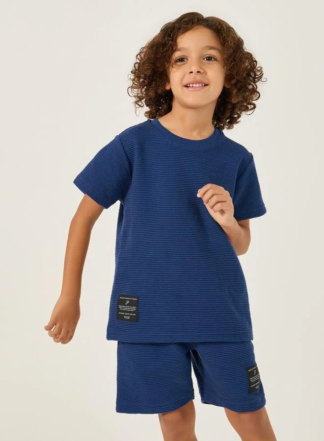 Styli Styli Textured T-Shirt with Badge Detail and Shorts Set