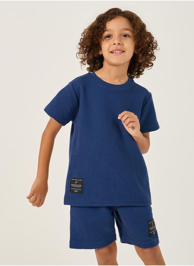 Styli Styli Textured T-Shirt with Badge Detail and Shorts Set  - Image 3