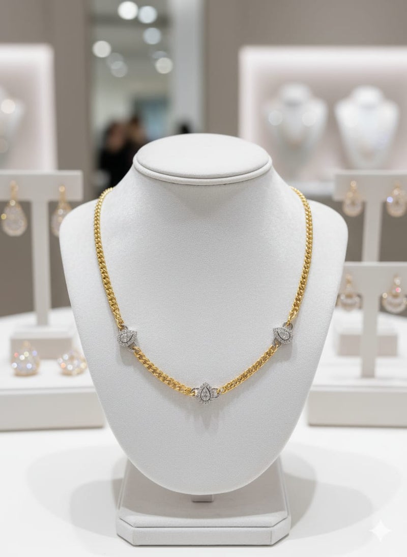 A necklace with a wide gold-plated chain, punctuated by three teardrop-shaped or pear-shaped pendants. Silver-tone polished links for adjustability. - Image 2