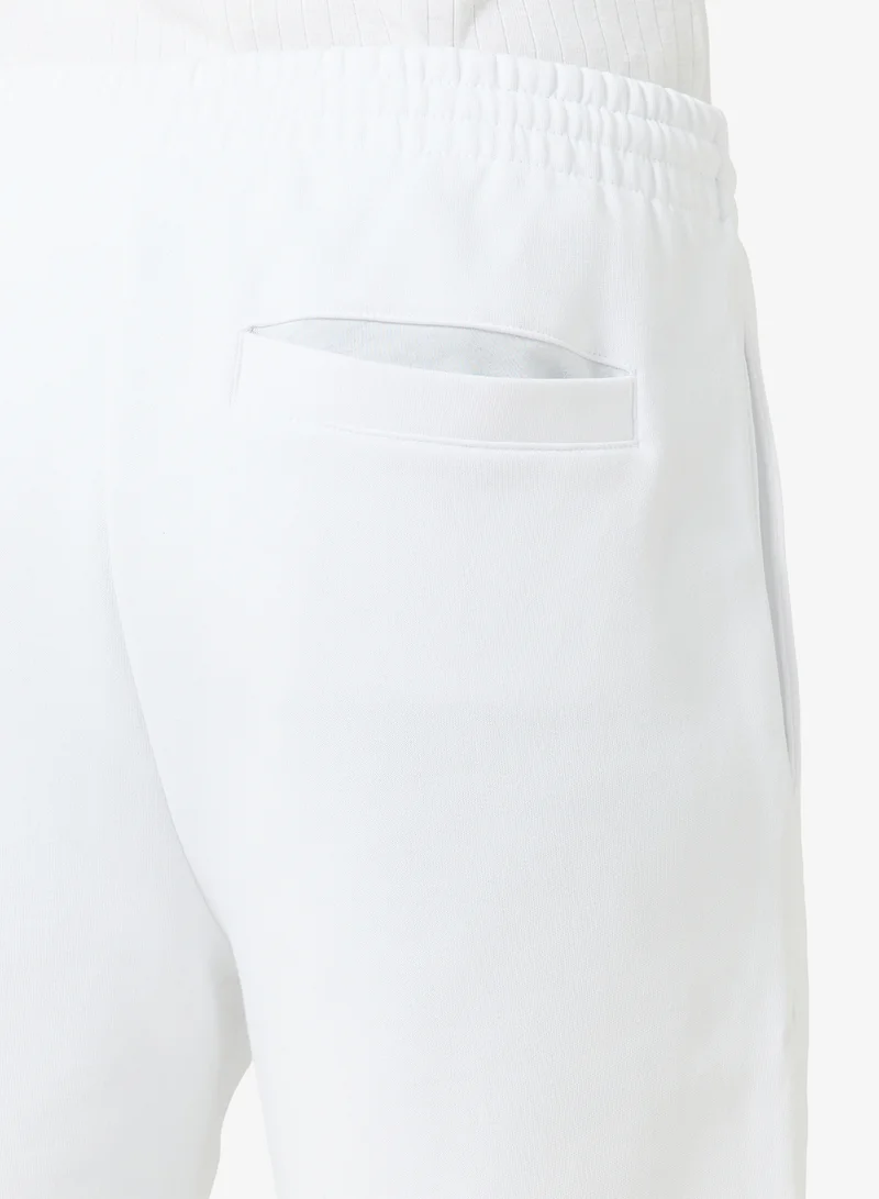 Lacoste white Regular Fit Brushed Fleece Shorts for Men | Best Price UAE