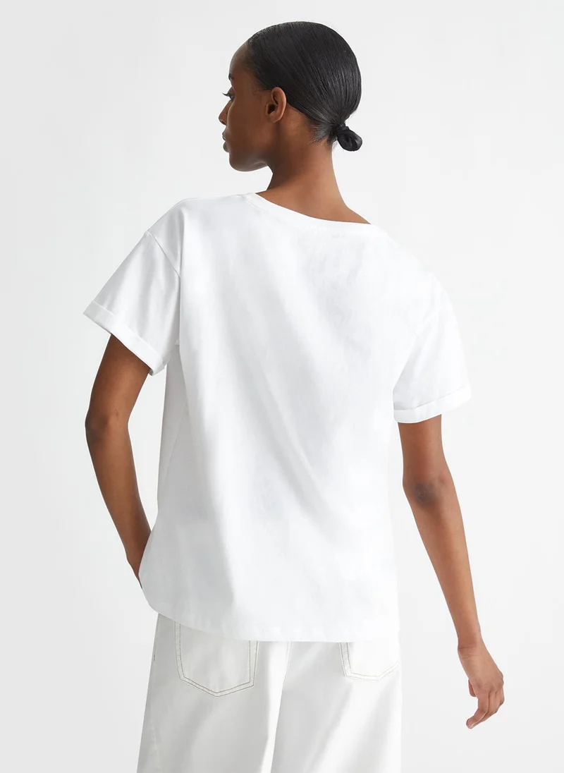 ليو جو تي شيرت بجيب مزين بأحجار الراين