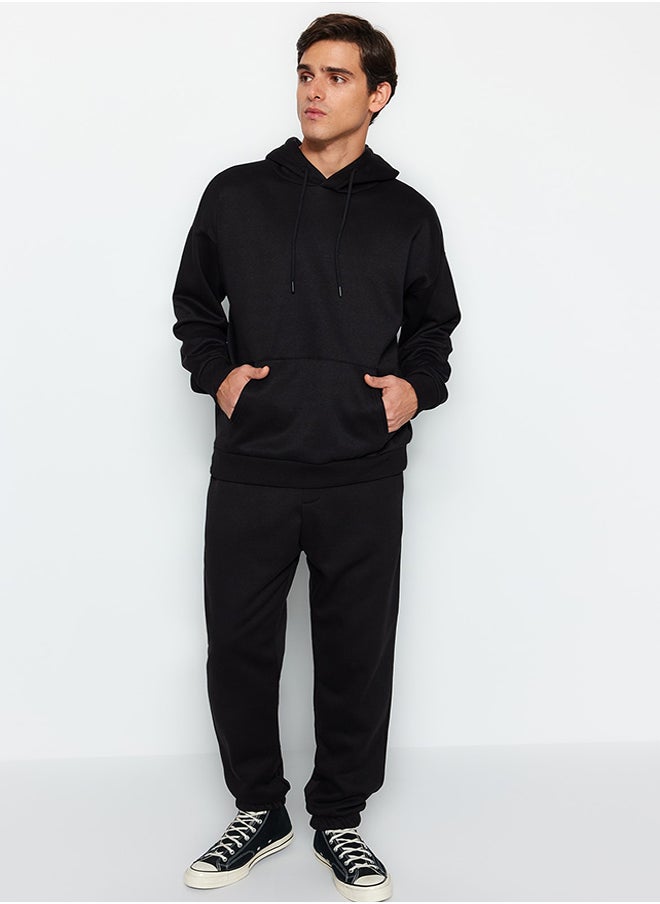 trendyol Black Oversize/Wide Cut Basic Cotton Tracksuit with Elasticized Legs and Fleece Inside TMNAW24EM00002  - Image 1