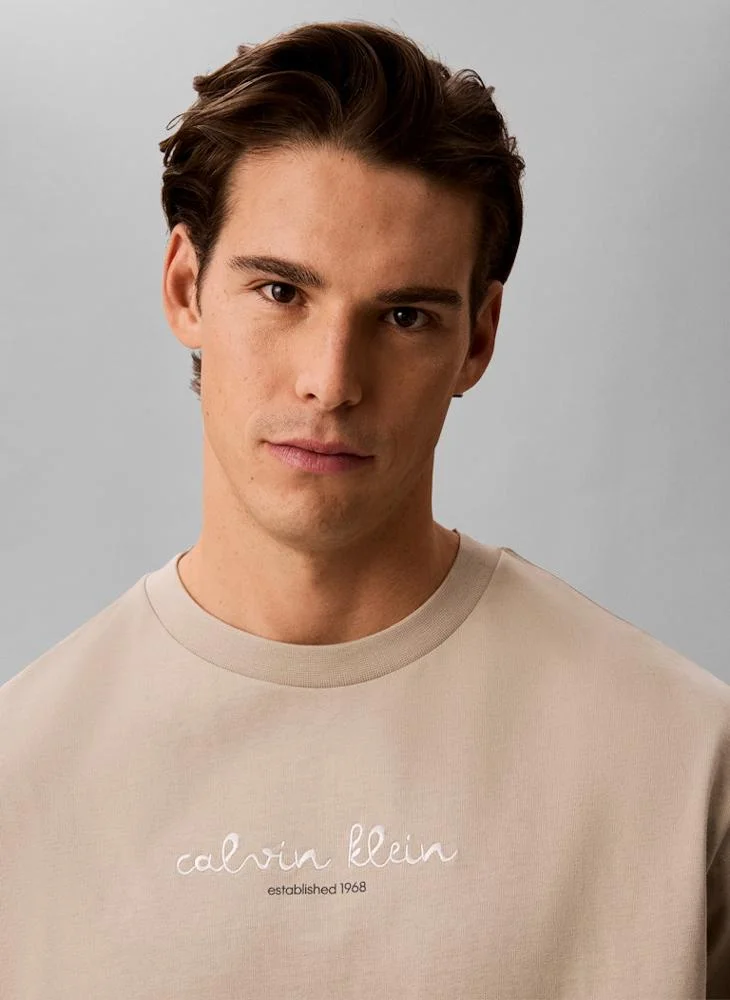 Calvin Klein Jeans Plaza Taupe Line Logo Graphic Relaxed T‑Shirt for Men | Best Price UAE