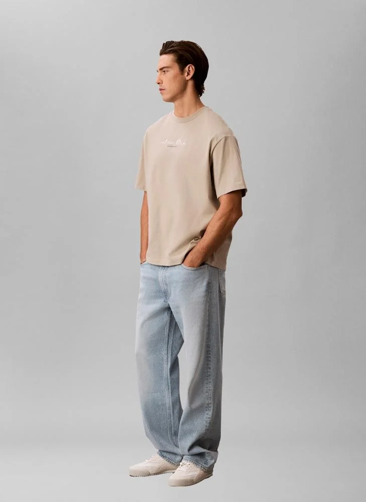 Calvin Klein Jeans Plaza Taupe Line Logo Graphic Relaxed T‑Shirt for Men | Best Price UAE