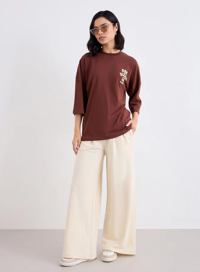 Styli Styli Brown Oversized Back Graphic Print T-Shirt