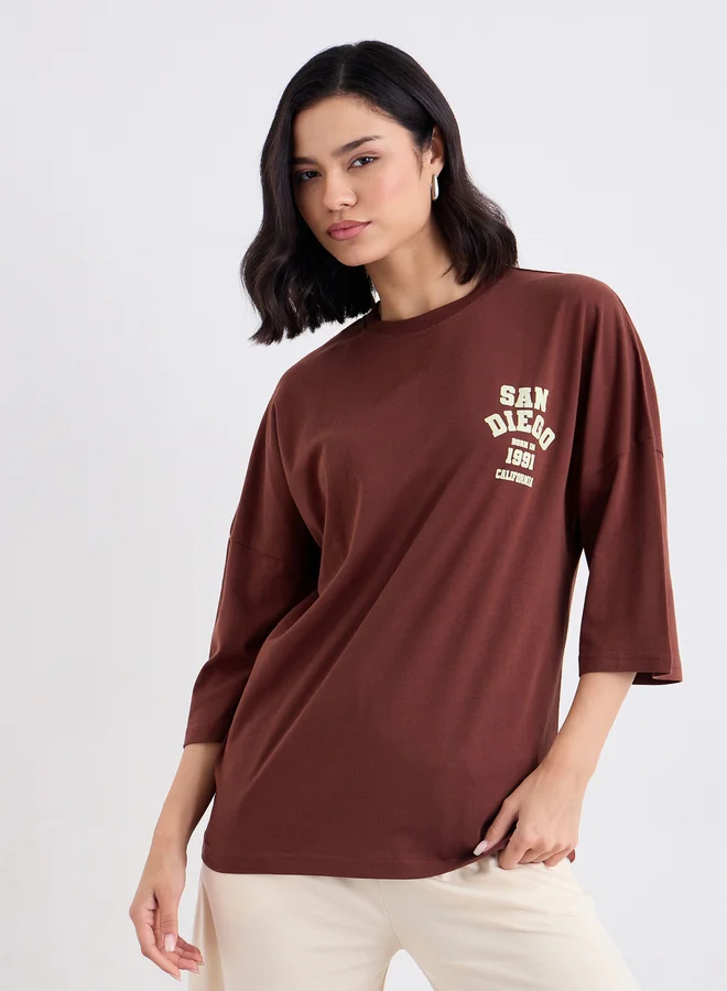 Styli Styli Brown Oversized Back Graphic Print T-Shirt