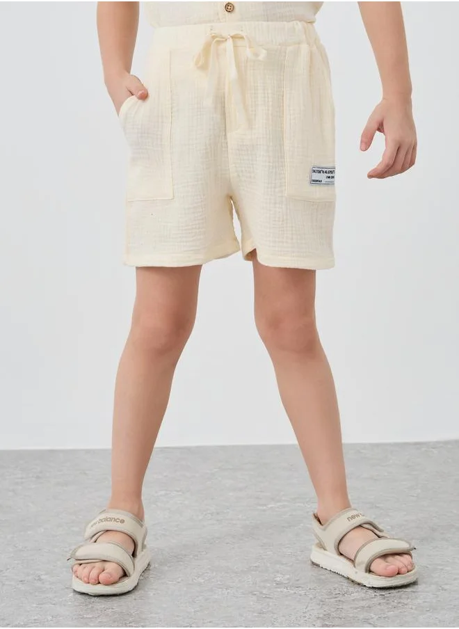 ستايلي Styli Textured Badge Detail Shorts with Drawstring