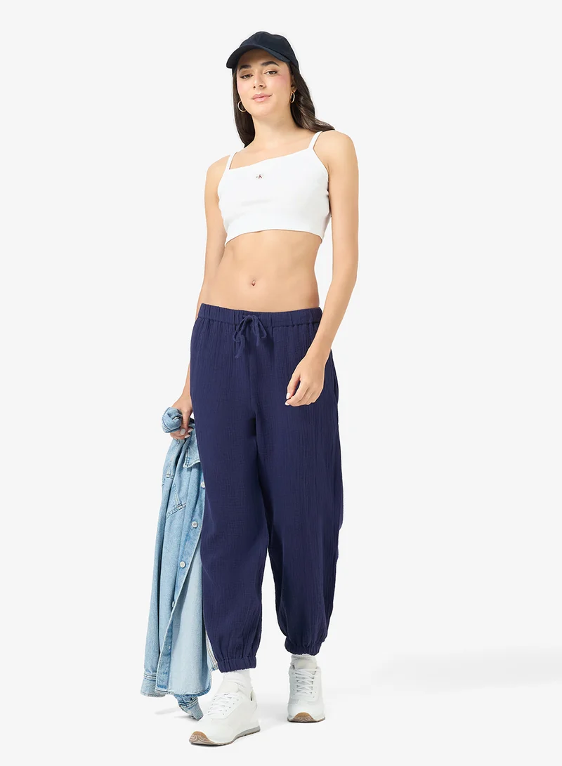 Calvin Klein Jeans  Casual Woven Label 2X2 Baby Rib Crop Top for Women | Best Price UAE