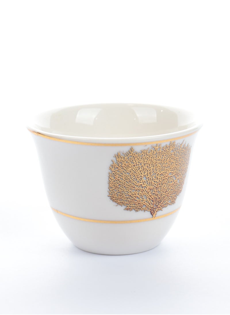 A set of glass and ceramic tea cups and coffee cups with luxurious golden leaf patterns - a luxurious design for a distinctive taste