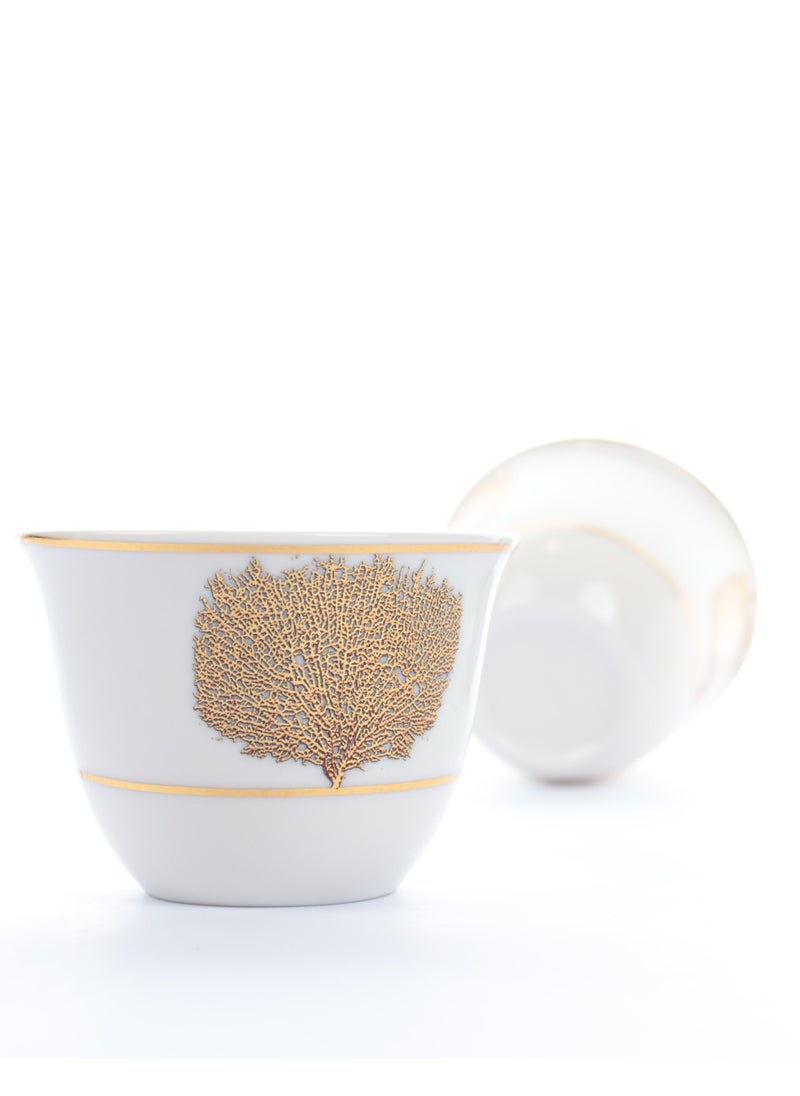 A set of glass and ceramic tea cups and coffee cups with luxurious golden leaf patterns - a luxurious design for a distinctive taste