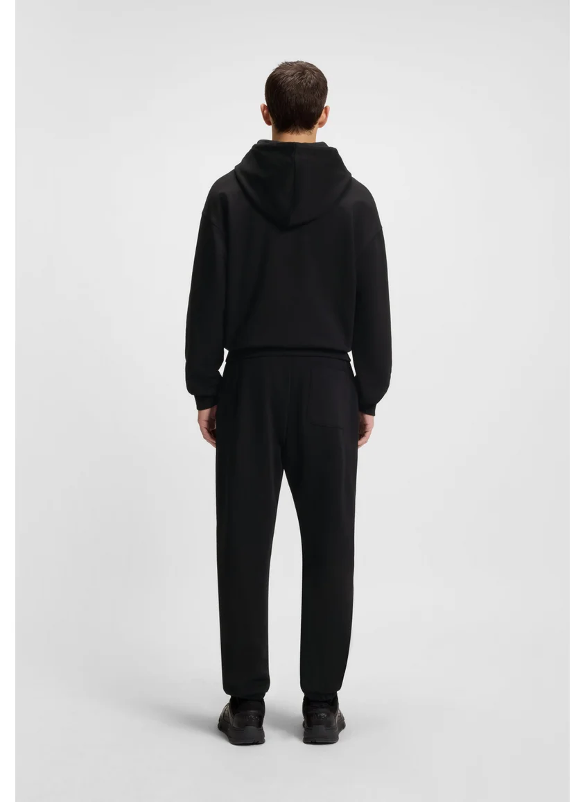 HUGO Cotton-terry tracksuit bottoms with split logo