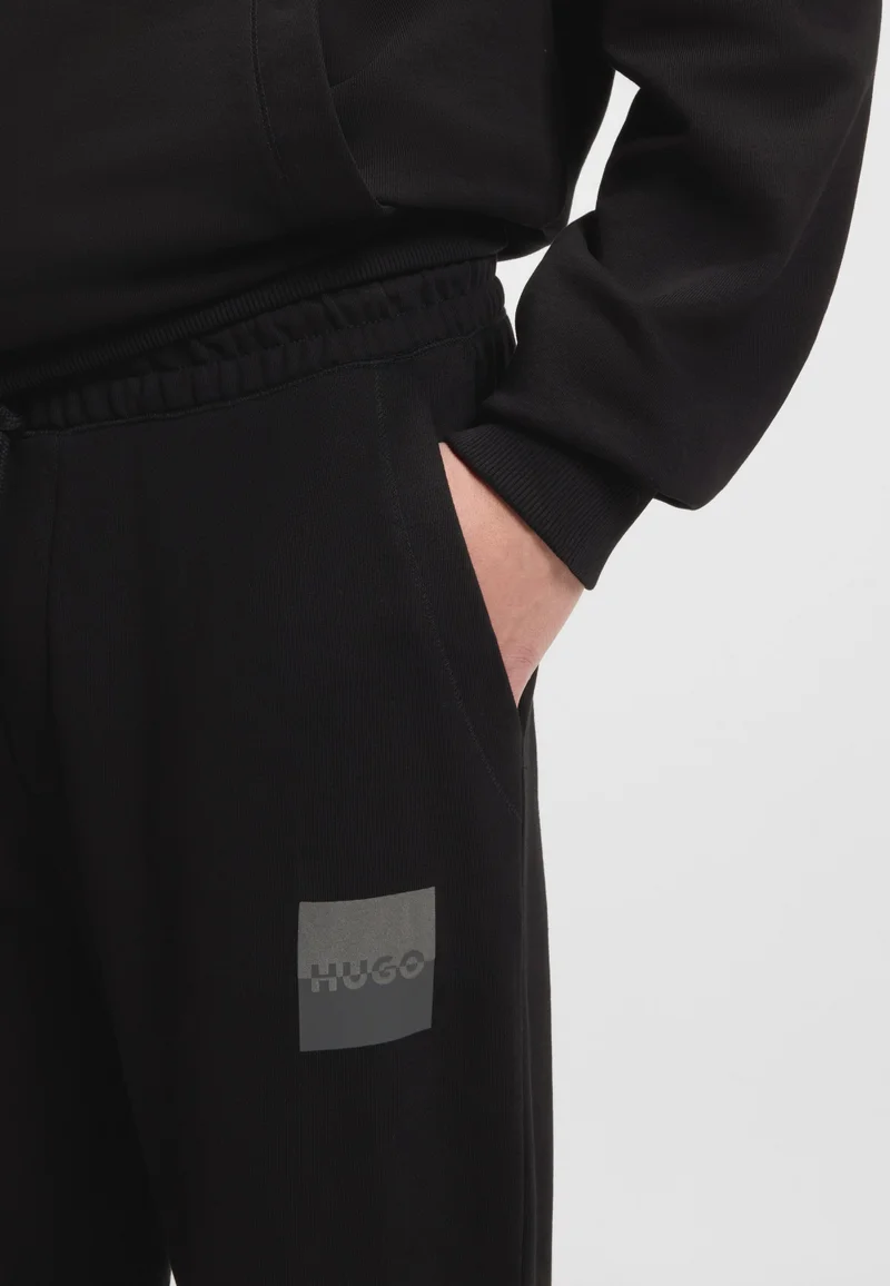 HUGO Cotton-terry tracksuit bottoms with split logo