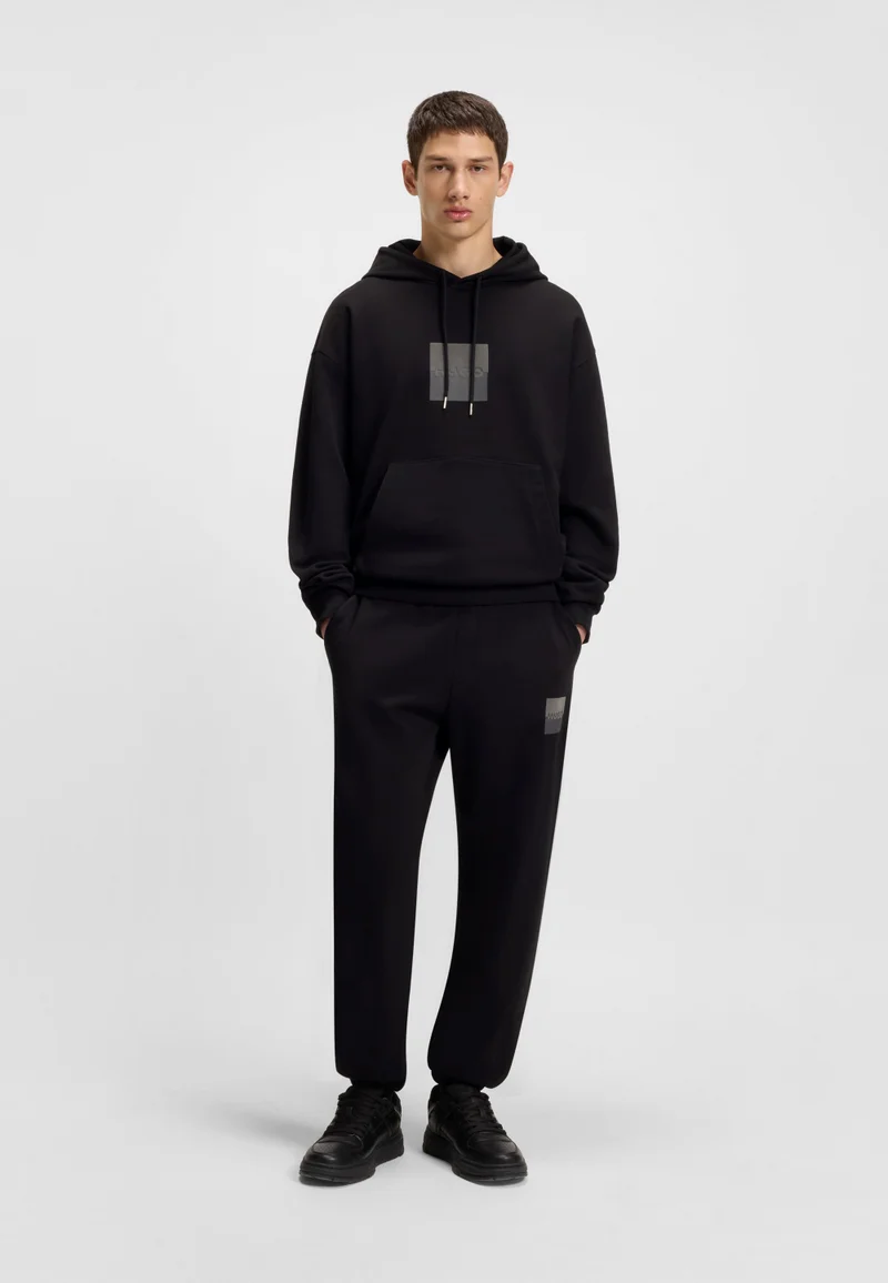 HUGO Cotton-terry tracksuit bottoms with split logo
