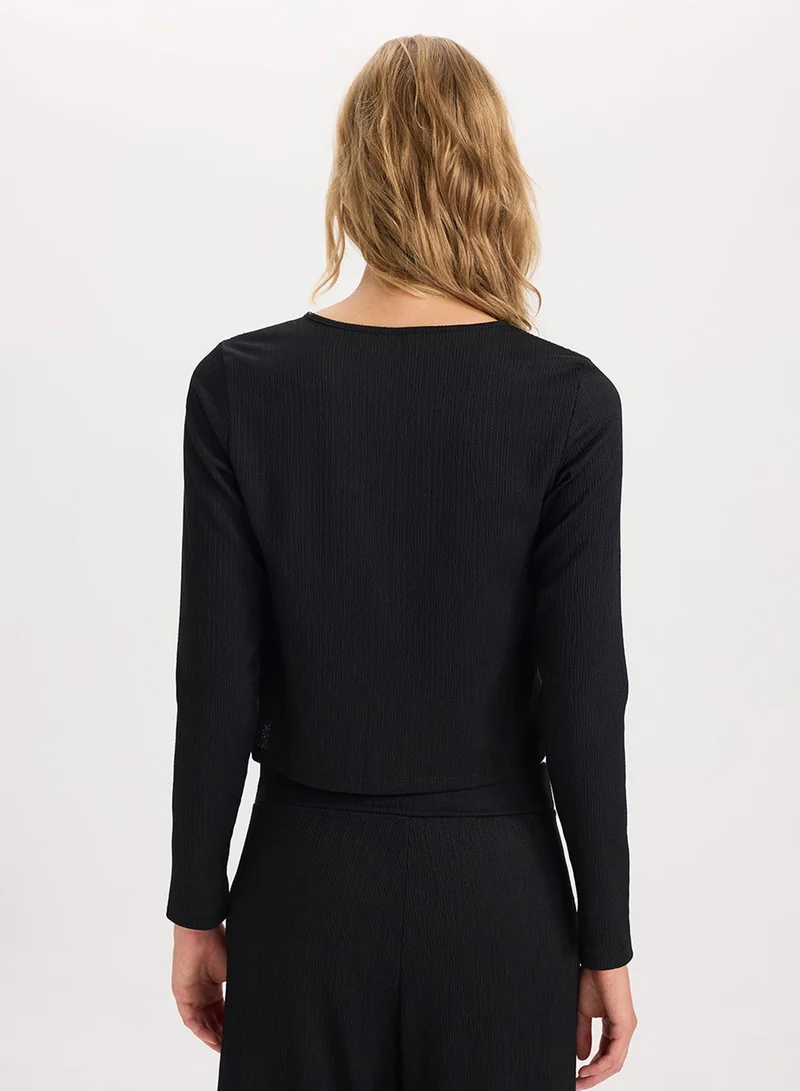 ديفاكتو كارديجان أسود بأكمام طويلة بقصة عادية وتفاصيل ثنيات