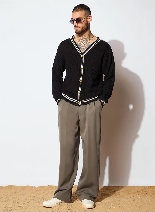 ماسكلن ساسافراس Unisex Black and Off White Front Button Cardigan by Styli