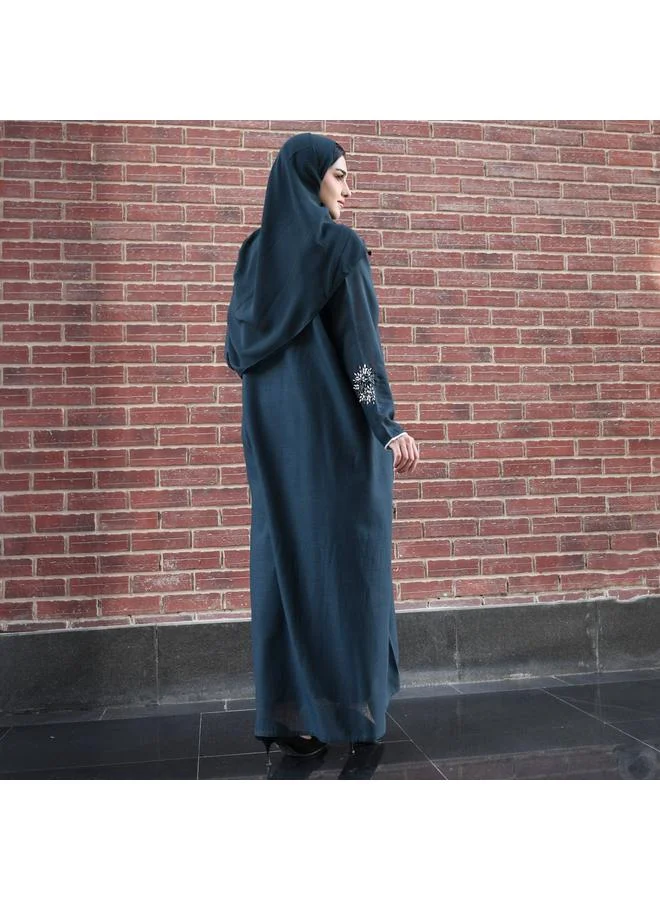 HAWRAA ABAYA Dark green wrap abaya decorated with prominent embroidery and strings on the edges of the abaya and sleeves