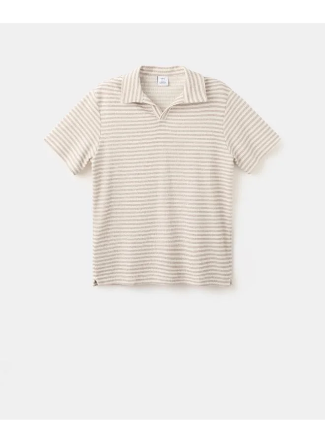 Mango Man  Regular fit textured stripe polo for Men | Best Price UAE