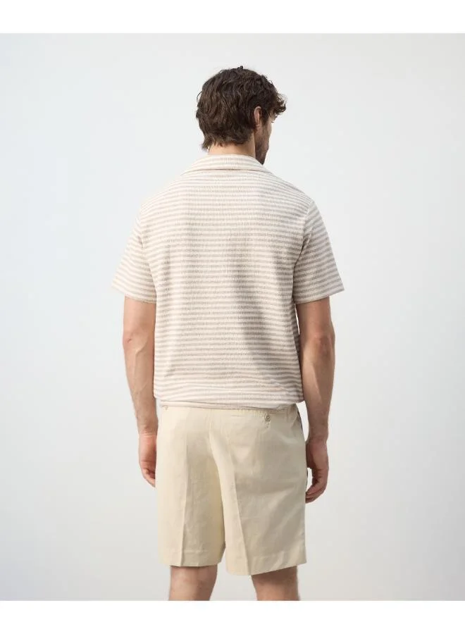 Mango Man  Regular fit textured stripe polo for Men | Best Price UAE