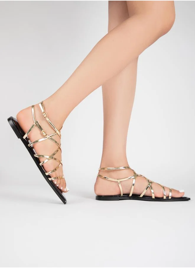 RAID Metallic Ankle Strap Flat Sandals by Styli