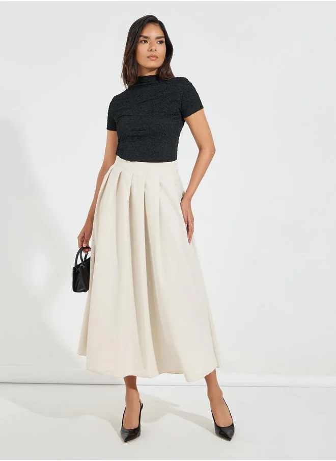 Styli Solid Box Pleated Flared Maxi Skirt