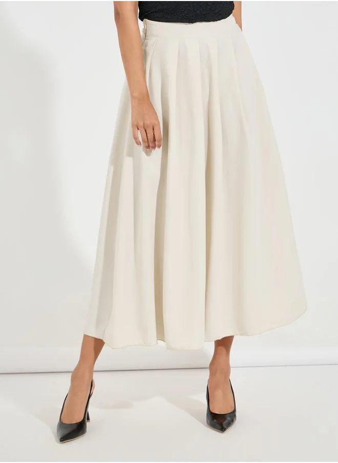 Styli Solid Box Pleated Flared Maxi Skirt